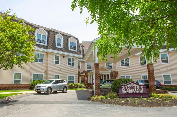 Angela Court senior living building front entrance.