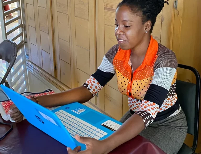 Haiti remote tutor at her computer