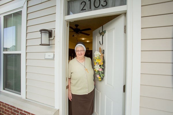 Sister opening door.