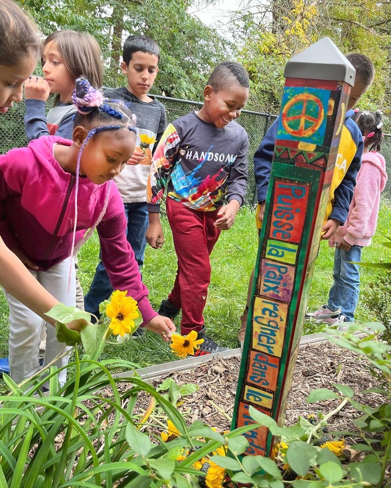 Happy children with flowers outdoors